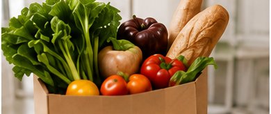 Paper grocery bag filled with fresh produce and bread